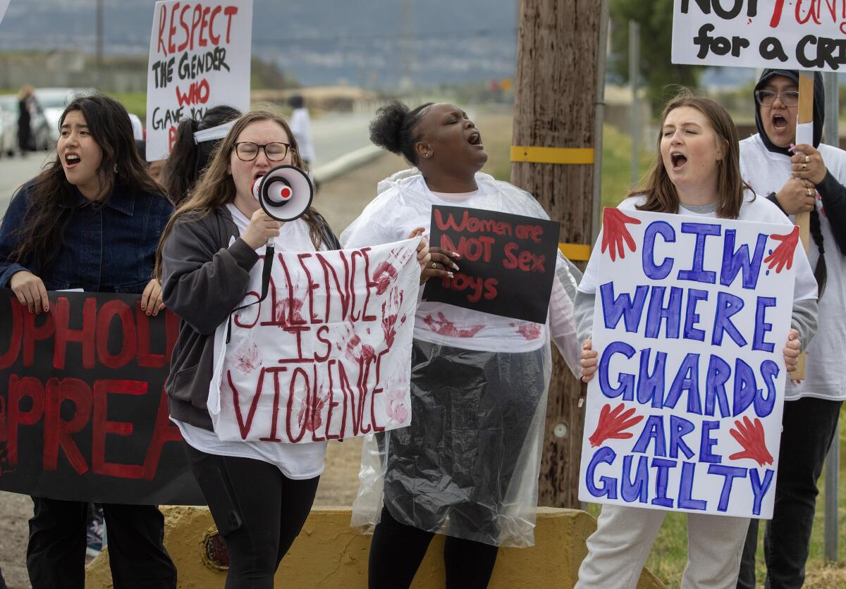 Protesters with signs and bullhorns.