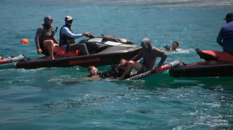 Rescue of a person in the water by jet skis.