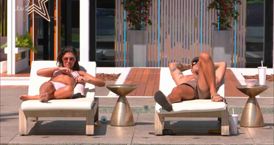 Samie Elishi and Luca Bish lounging by a pool.