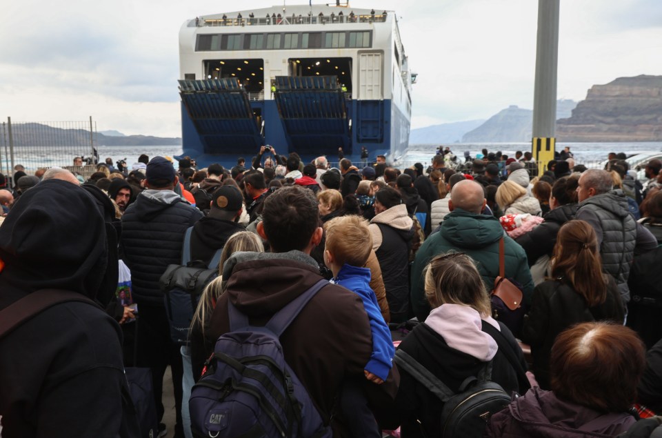 Tourists and residents evacuating Santorini by ferry after a series of earthquakes.