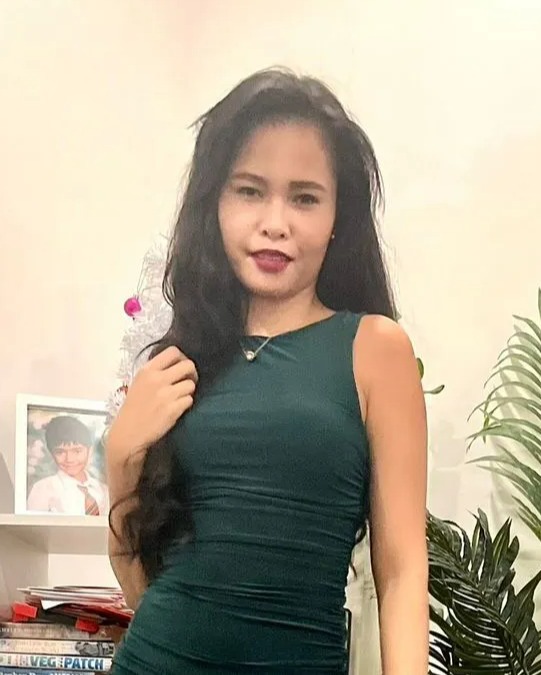 Woman in a green dress.