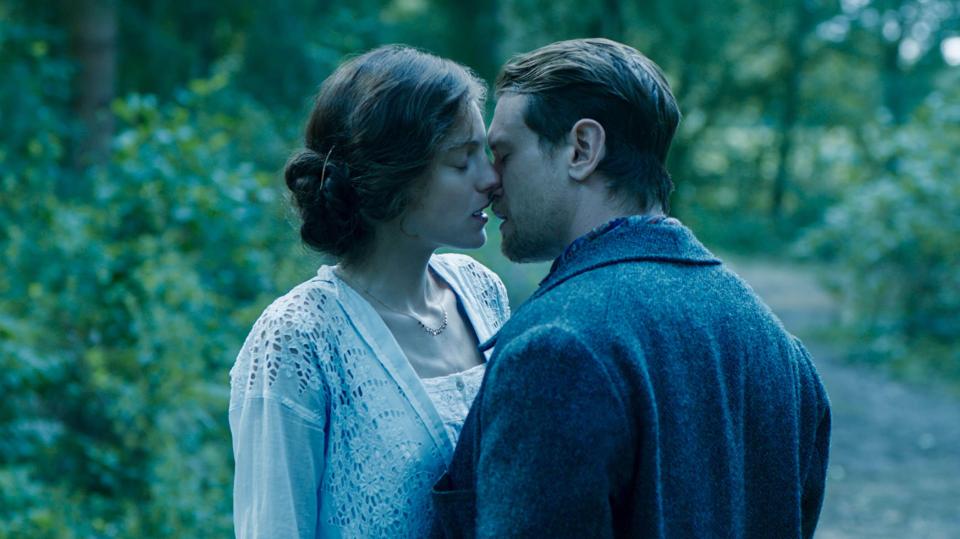 Emma Corrin and Jack O'Connell kissing in Lady Chatterley's Lover.