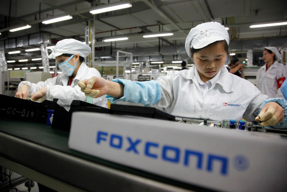 Foxconn factory workers assembling electronics.