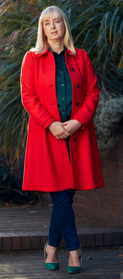 Portrait of Nataly Anderson in a red coat.