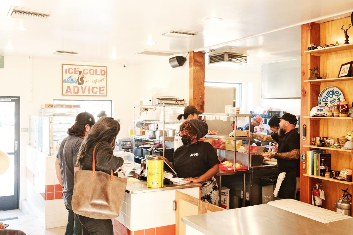 An interior of Yellow Paper Burger in Eagle Rock: customers order at the counter