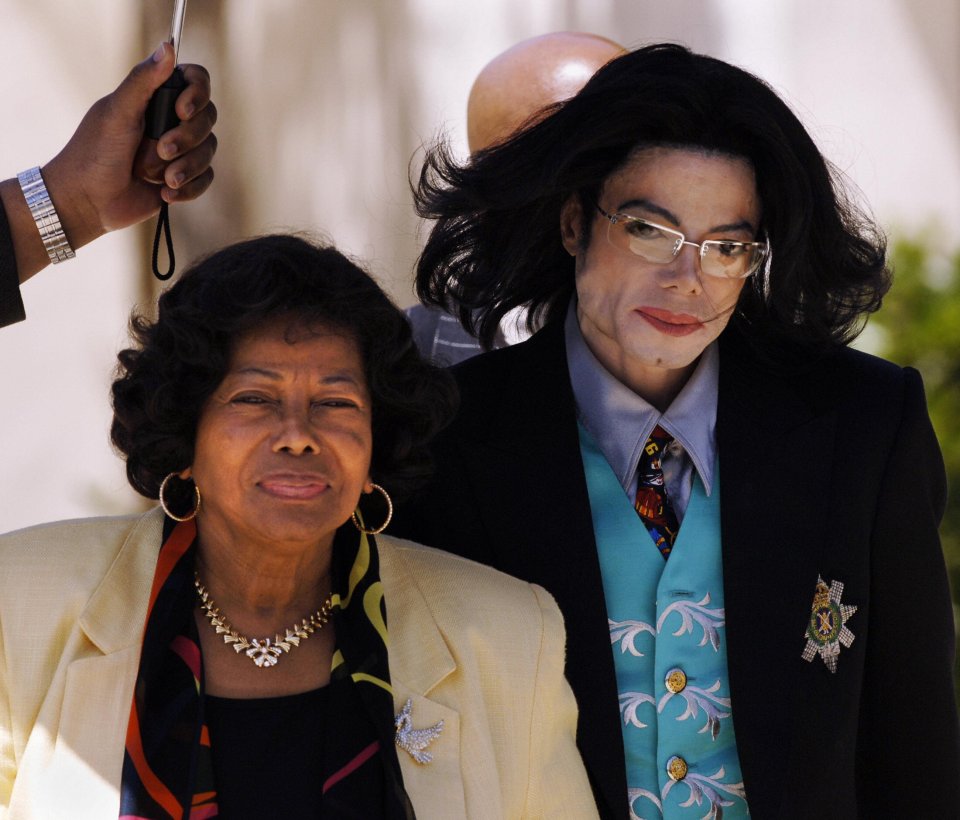 Michael Jackson and his mother, Katherine Jackson, leaving court during his child molestation trial.