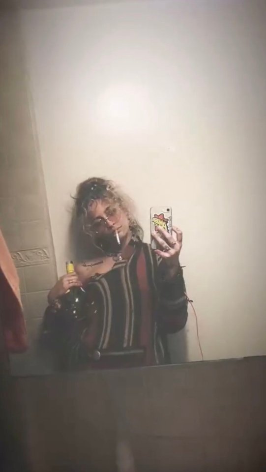 Paris Jackson taking a selfie in a bathroom mirror.