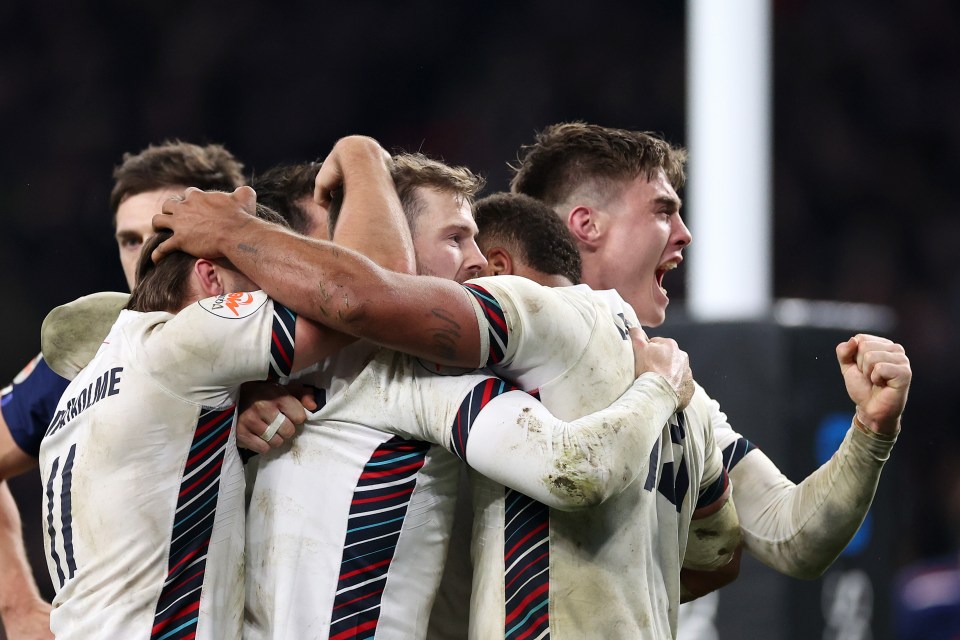 England rugby players celebrating a try.