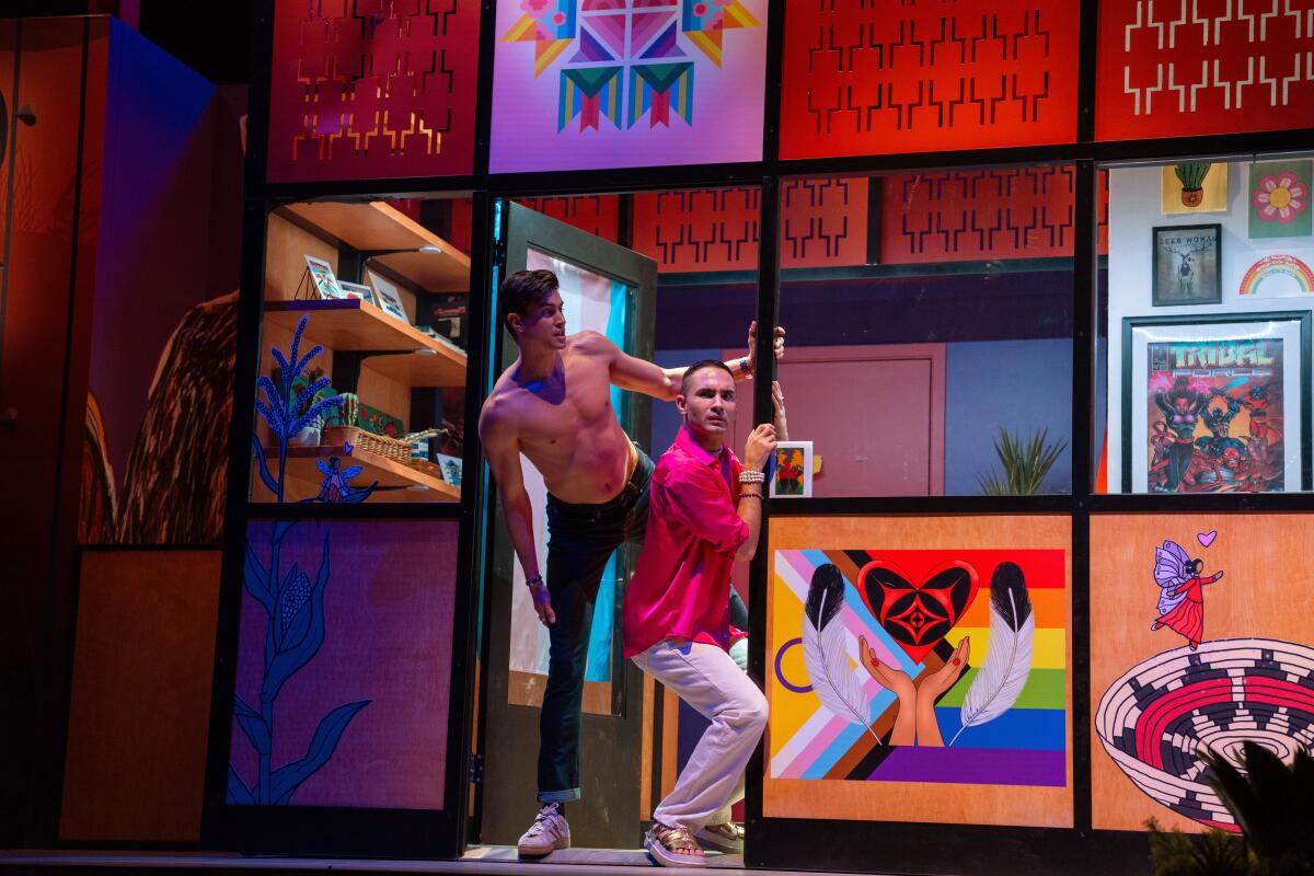 Two people peer out of an office door in a colorful stage set.