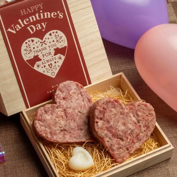 Heart-shaped Valentine's Day gift of meat in a wooden box.