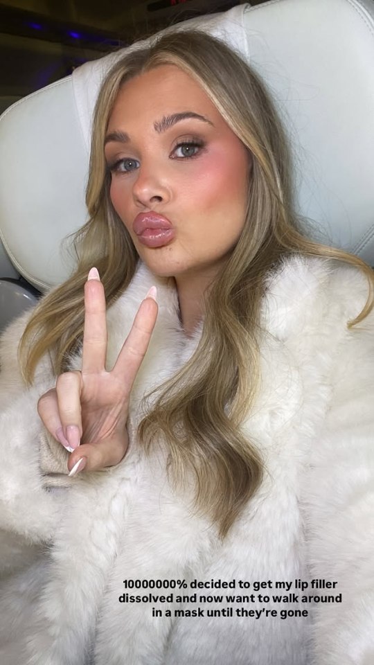 Shaughna Phillips making a peace sign, regretting lip filler.