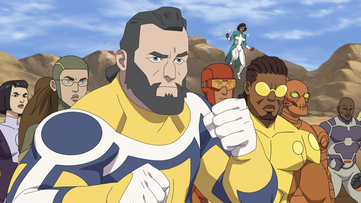 An animated image of a group of superheroes preparing for a fight.