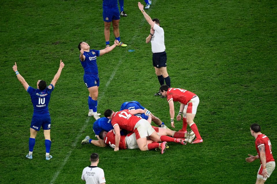 Italian rugby players celebrating a victory.