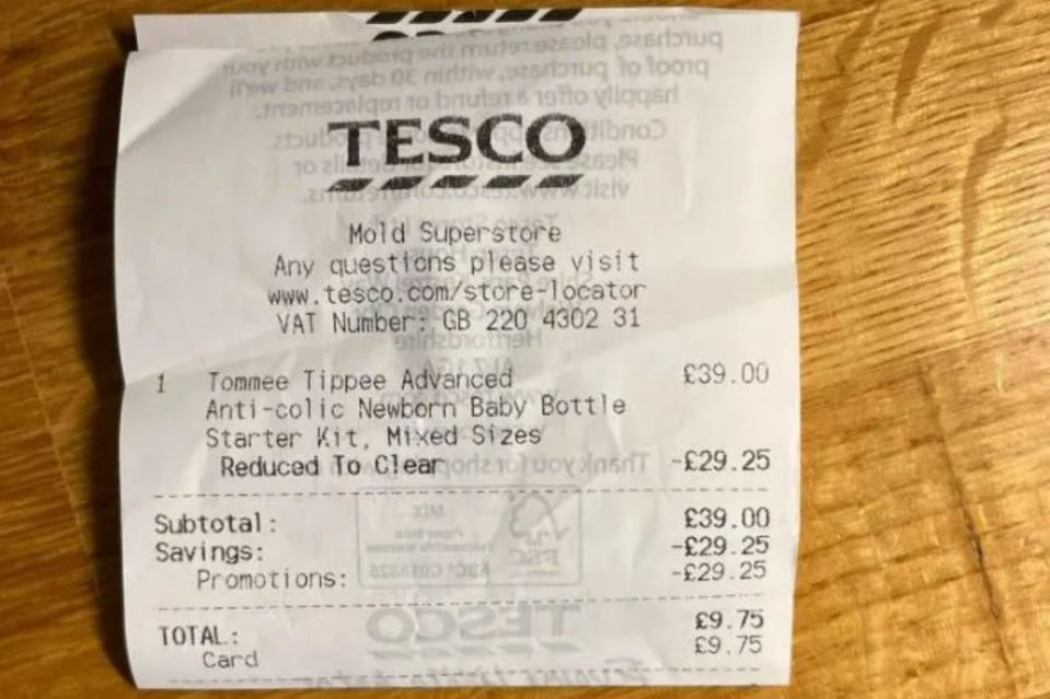 Tesco receipt showing a reduced price for a Tommee Tippee baby bottle starter kit.