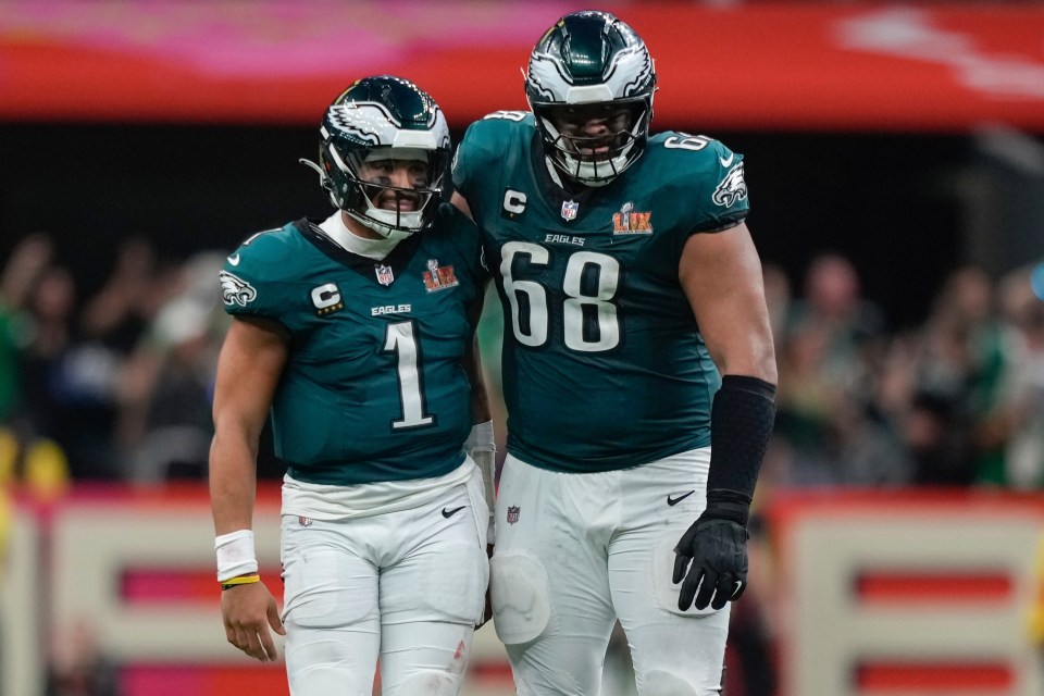 Philadelphia Eagles quarterback Jalen Hurts and offensive tackle Jordan Mailata after a touchdown.