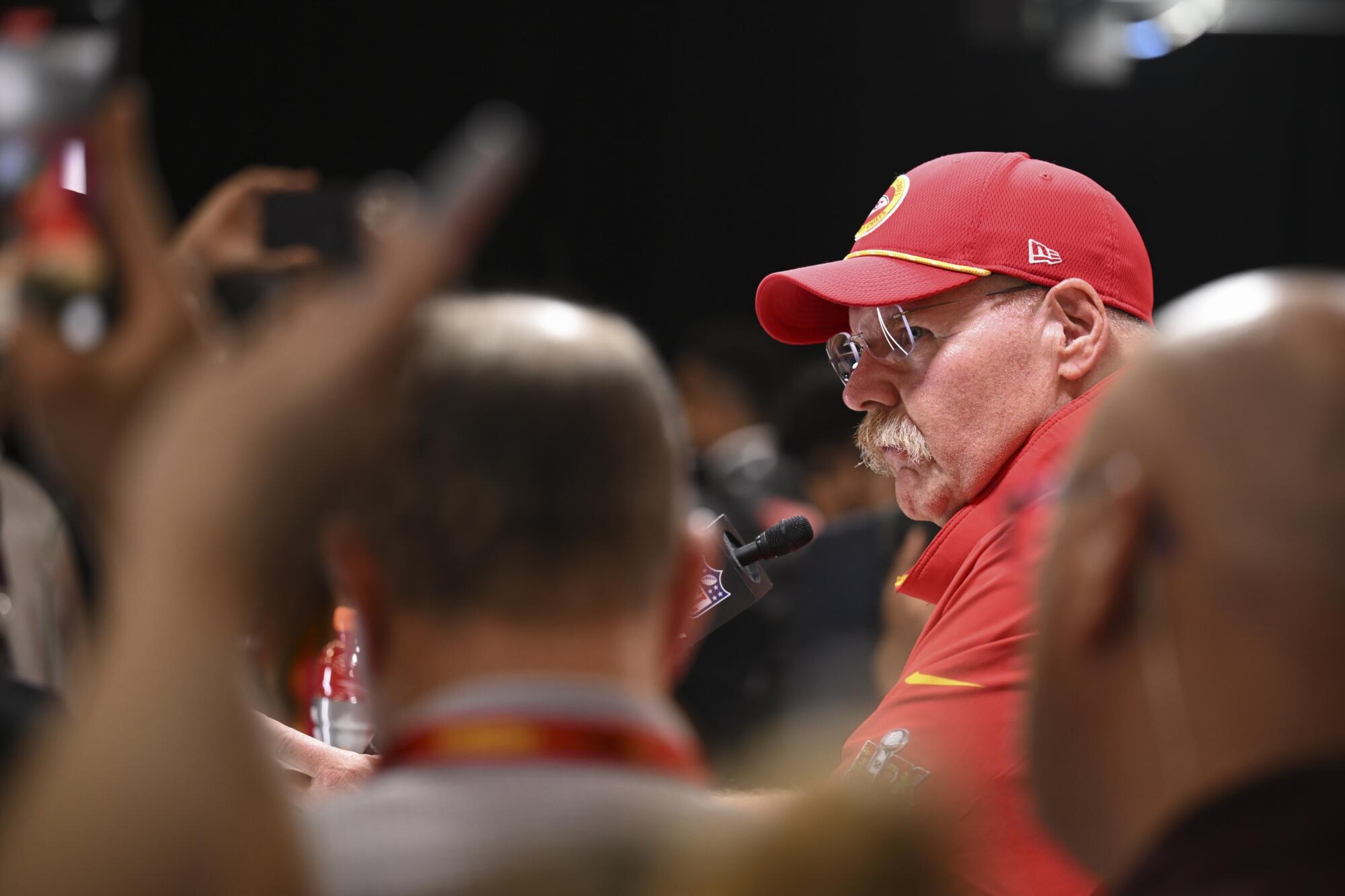 Kansas City Chiefs head coach Andy Reid speaks during a crowded news conference after the Super Bowl