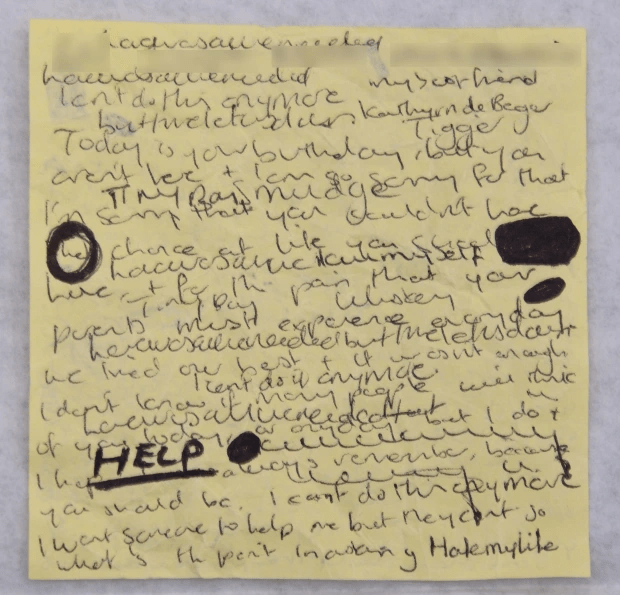 Handwritten note expressing distress and asking for help.