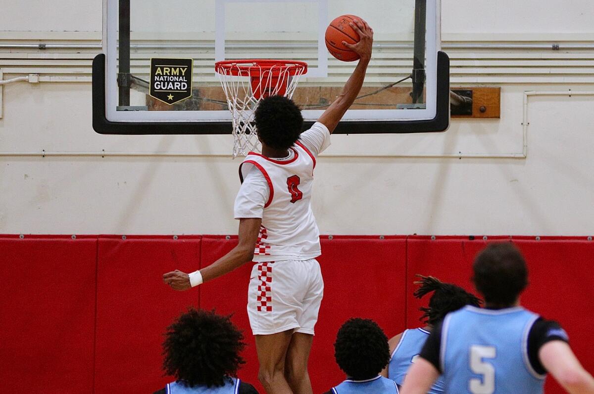 Tajh Ariza of Westchester delivers dunk and 22 points in win over Palisades.