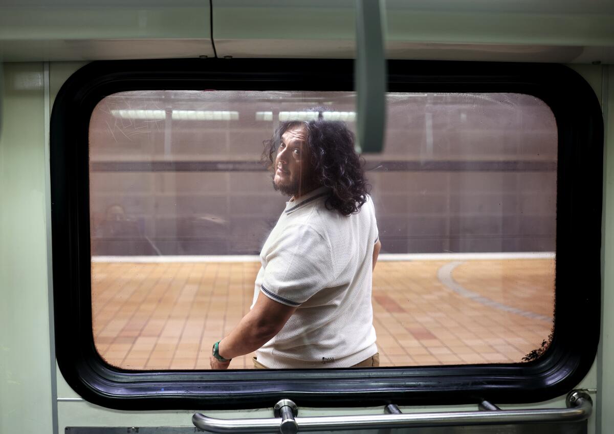 Felipe Esparza seen through a window