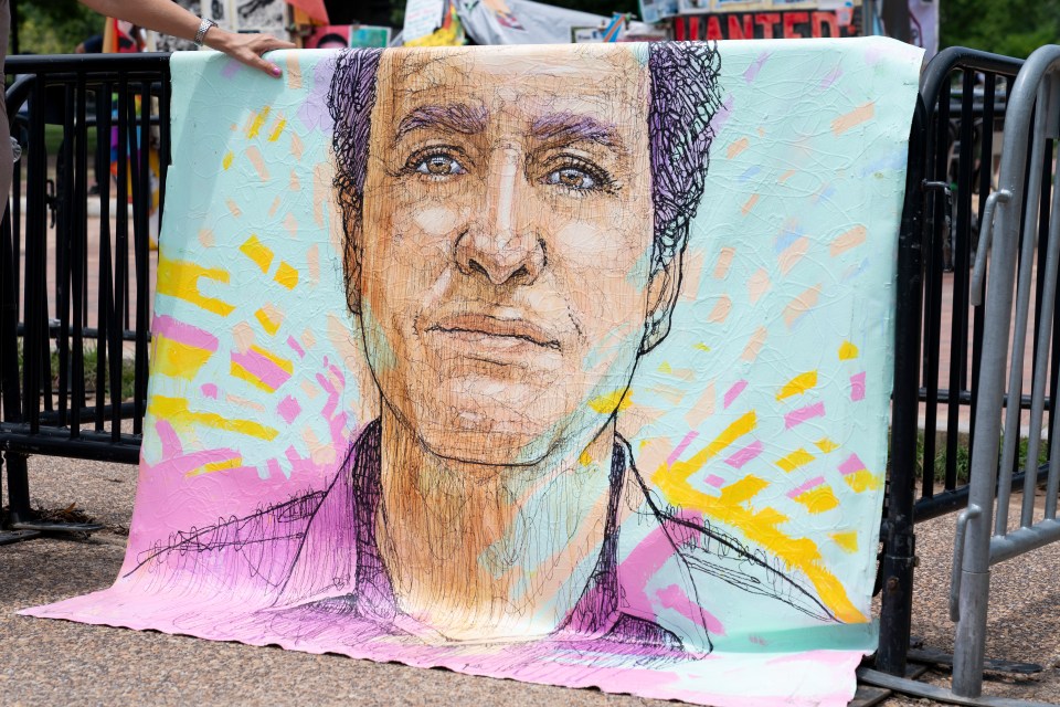 Illustration of Marc Fogel displayed at a White House demonstration.