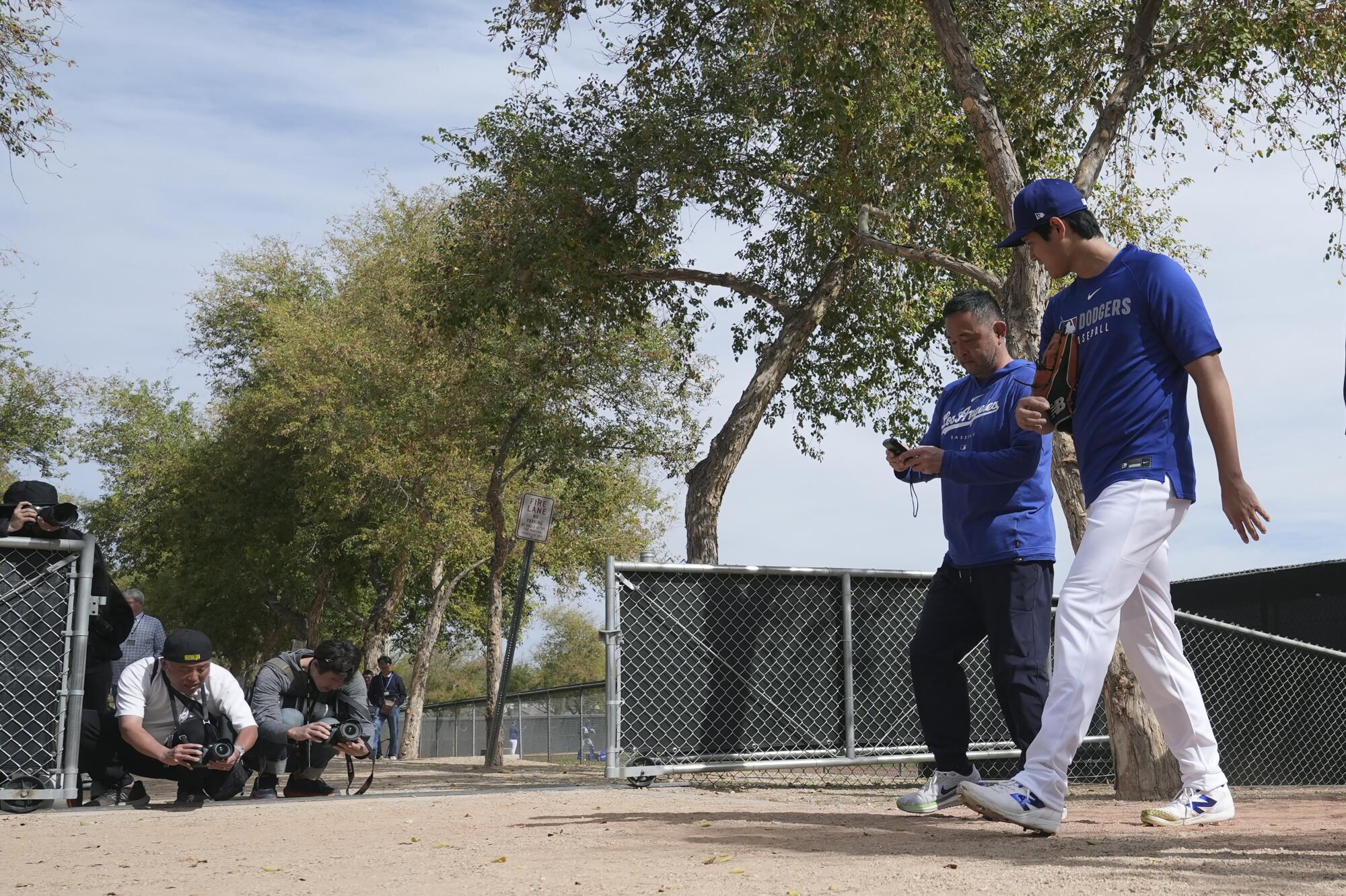 The Dodgers' Shohei Ohtani walks to the clubhouse at the team's spring training facility after working out 