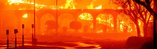 The Pasadena Jewish Temple & Center burns during the Eaton fire in Pasadena, California on January 7, 2025. A ferocious wildfire in a Los Angeles suburb devoured buildings and sparked panicked evacuations January 7, as hurricane-force winds tore through the region. More than 200 acres (80 hectares) was burning in Pacific Palisades, a upscale spot with multi-million dollar homes in the Santa Monica Mountains. Across town, on the northern edge of Los Angeles, another fire broke out in Eaton Canyon, near Pasadena, quickly consuming 200 acres (81 hectares) later in the night, according to Angeles National Forest officials. (Photo by JOSH EDELSON / AFP) (Photo by JOSH EDELSON/AFP via Getty Images)