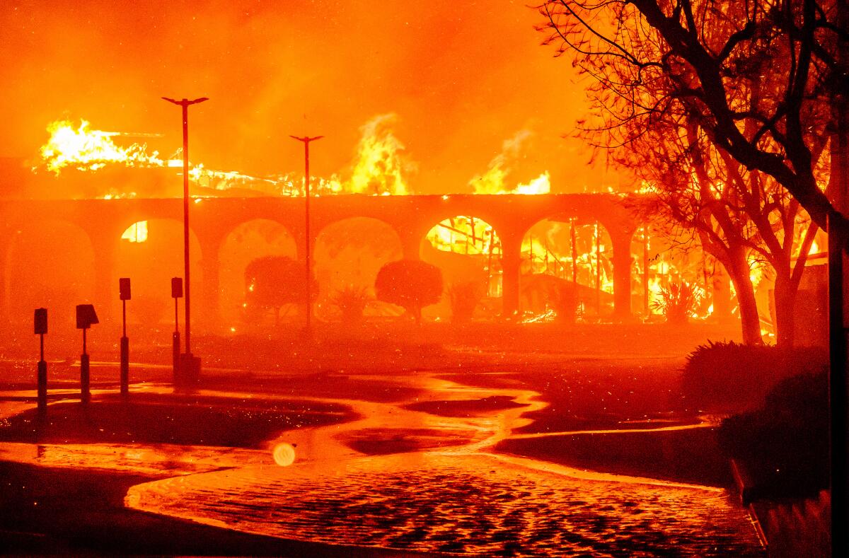 A building is engulfed in flames. 

