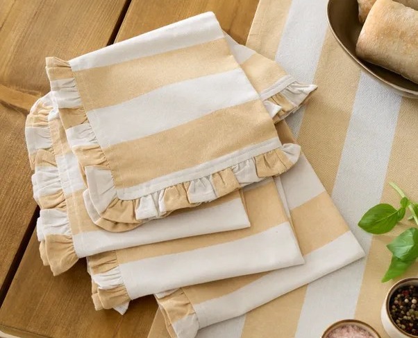 Stack of striped fabric napkins with ruffled edges.