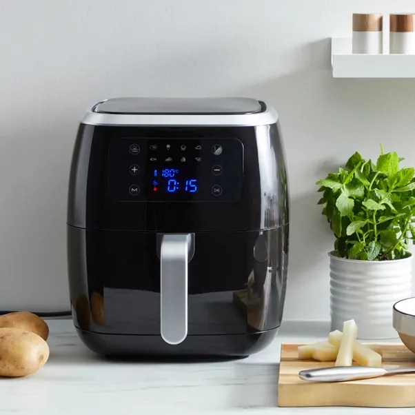 Black air fryer with digital display.