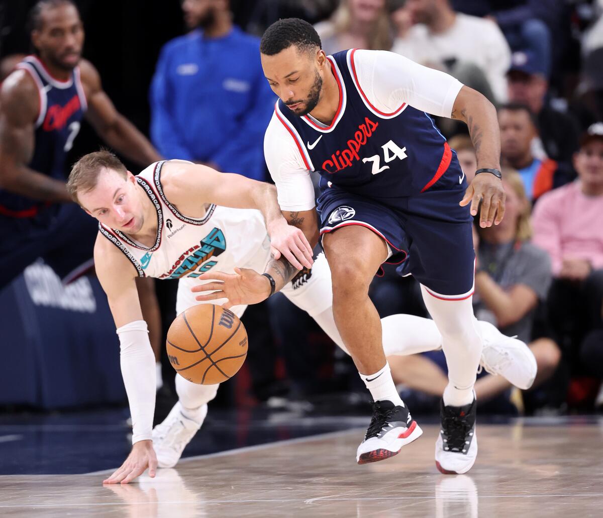 Norman Powell steals the ball from Luke Kennard in the second half.