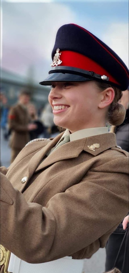 Photo of a smiling young woman in a military uniform.