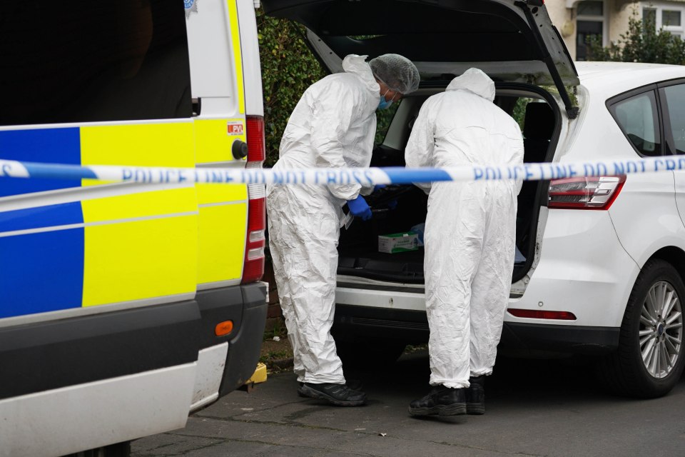 Forensic investigators at a crime scene.