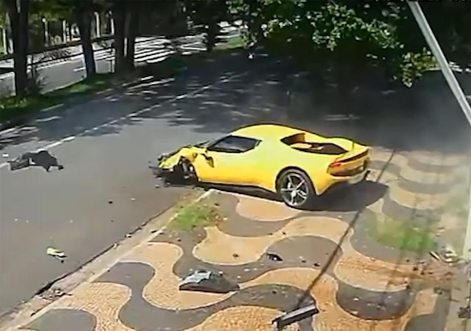 Yellow Ferrari crashing into a house.