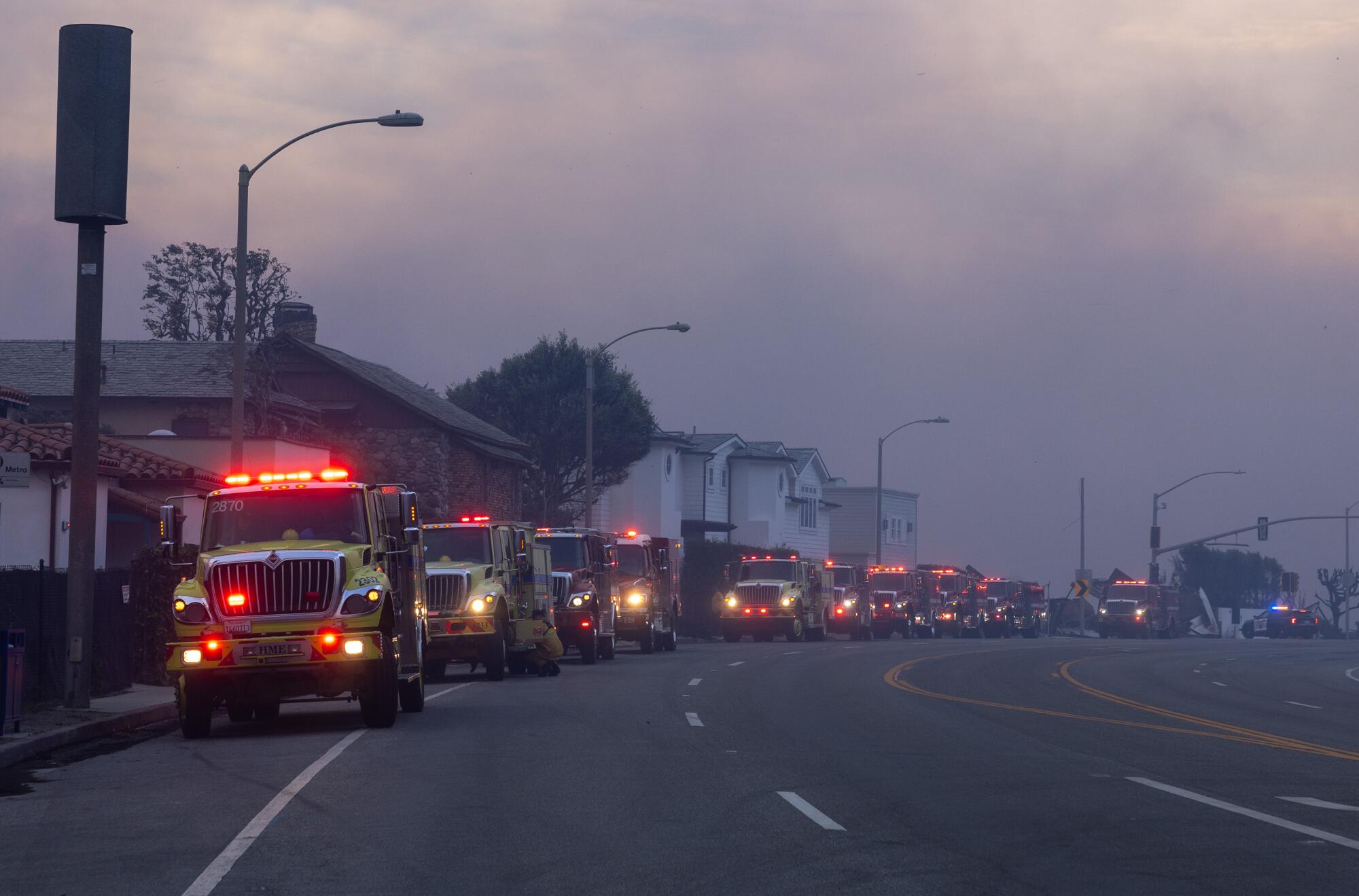 Firetrucks line Pacific Coast Highway in Malibu on Jan. 8 to provide structural protection for beachfront homes.