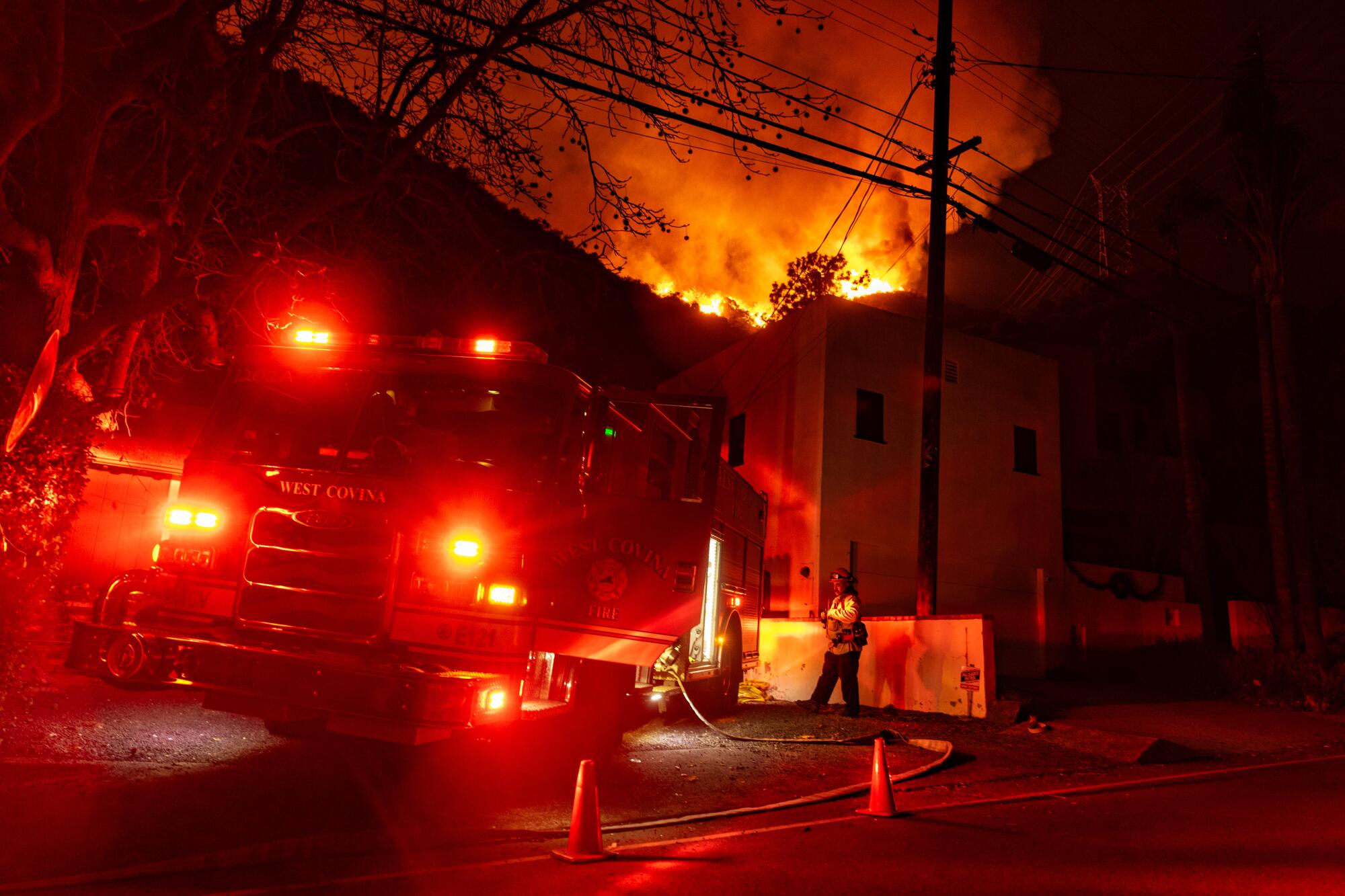 The Palisades fire spreads through Mandeville Canyon toward Encino on Jan. 10.