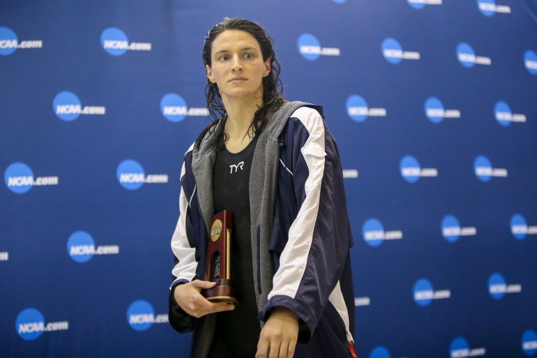 Mar 18, 2022; Atlanta, Georgia, USA; Penn Quakers swimmer Lia Thomas holds a trophy after finishing fifth in the 200 free at the NCAA Swimming & Diving Championships at Georgia Tech. Mandatory Credit: Brett Davis-USA TODAY Sports