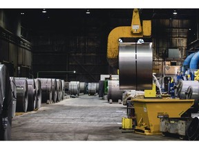 A finished steel coil is lifted at a plant in Farrell, Pennsylvania. Photographer: Allison Farrand/Bloomberg