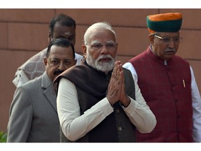 Narendra Modi, India's prime minister, center, arrives for a news conference prior to a budget session at Parliament House in New Delhi, India, on Friday, Jan. 31, 2025. Modi said the upcoming budget will provide energy and confidence to the country as it moves toward achieving its goal of becoming a developed nation by 2047.