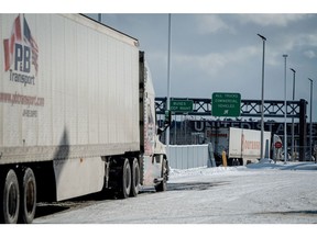 Trucks at the Canada-US border crossing in St-Bernard-de-Lacolle, Quebec, Canada, on Tuesday, Feb. 4, 2025. US President Donald Trump and Canadian Prime Minister Justin Trudeau agreed to pause tariffs on a huge array of products on Monday after Canada agreed to take tougher measures to combat migration and drug trafficking at the border, warding off a continental trade war for now.