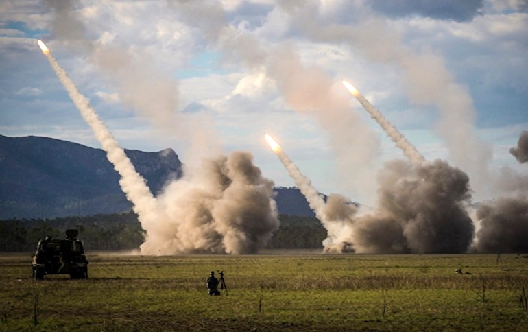 TOPSHOT - A missile is launched from a United States military HIMARS system during joint military drills at a firing range in northern Australia as part of Exercise Talisman Sabre, the largest combined training activity between the Australian Defence Force and the United States military, in Shoalwater Bay on July 22, 2023. (Photo by ANDREW LEESON / AFP)