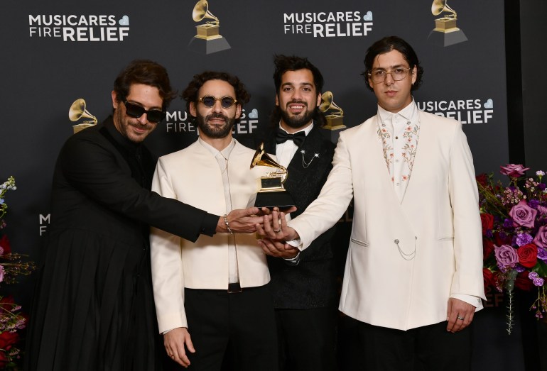 Alejandro Abeijon, from left, Andres Story, Antonio Casas and Alberto Montenegro of Rawayana arrive at the 67th annual Grammy Awards