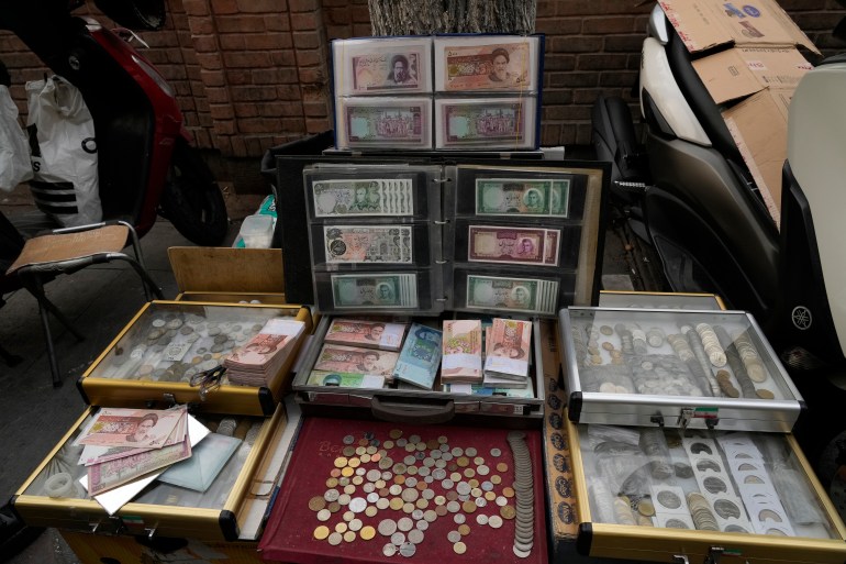 Currency and gold coins displayed in Iran