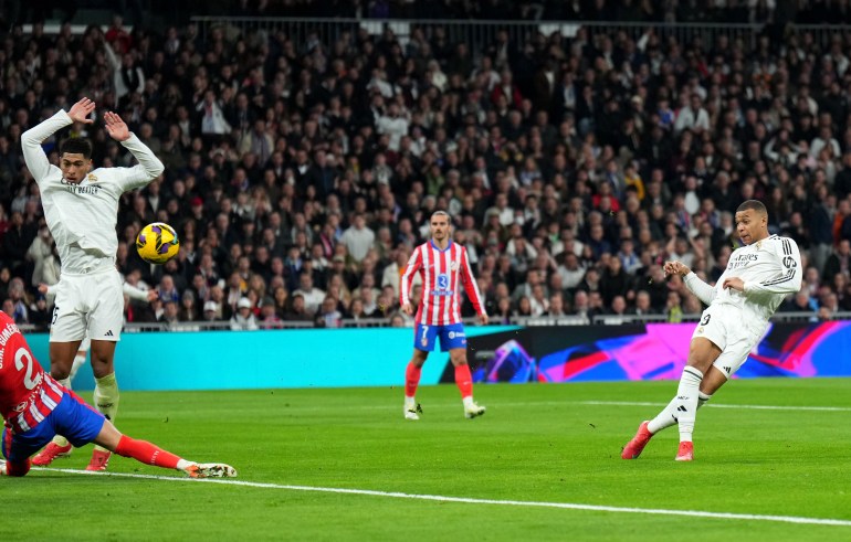 MADRID, SPAIN - FEBRUARY 08: Kylian Mbappe of Real Madrid scores his team's first goal during the LaLiga match between Real Madrid CF and Atletico de Madrid at Estadio Santiago Bernabeu on February 08, 2025 in Madrid, Spain. (Photo by Angel Martinez/Getty Images)