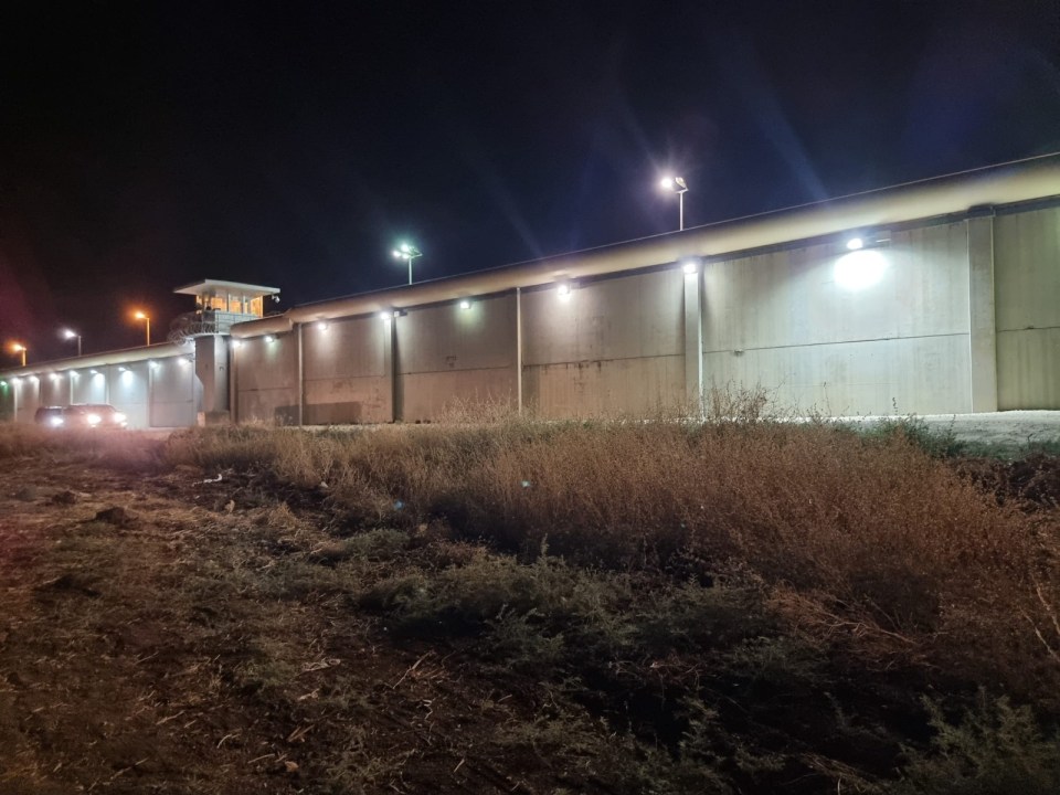 Nighttime view of the exterior of Gilboa Prison.