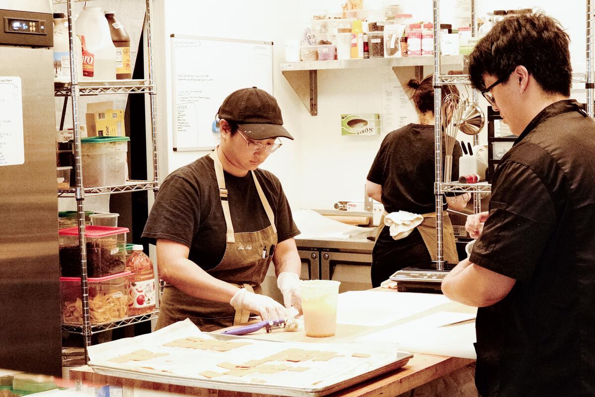 Pastry chef Isabell Manibusan, left, prepares sweets at Liu's Cafe Creamery.