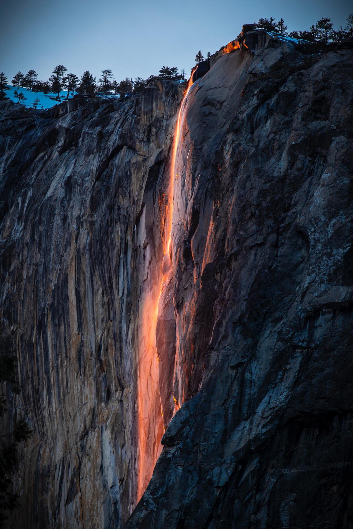 A waterfall glowing orange 