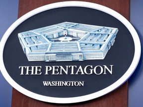 FILE - The Department of Defense logo is seen on the wall in the Press Briefing room at the Pentagon, Oct. 29, 2024, in Washington.