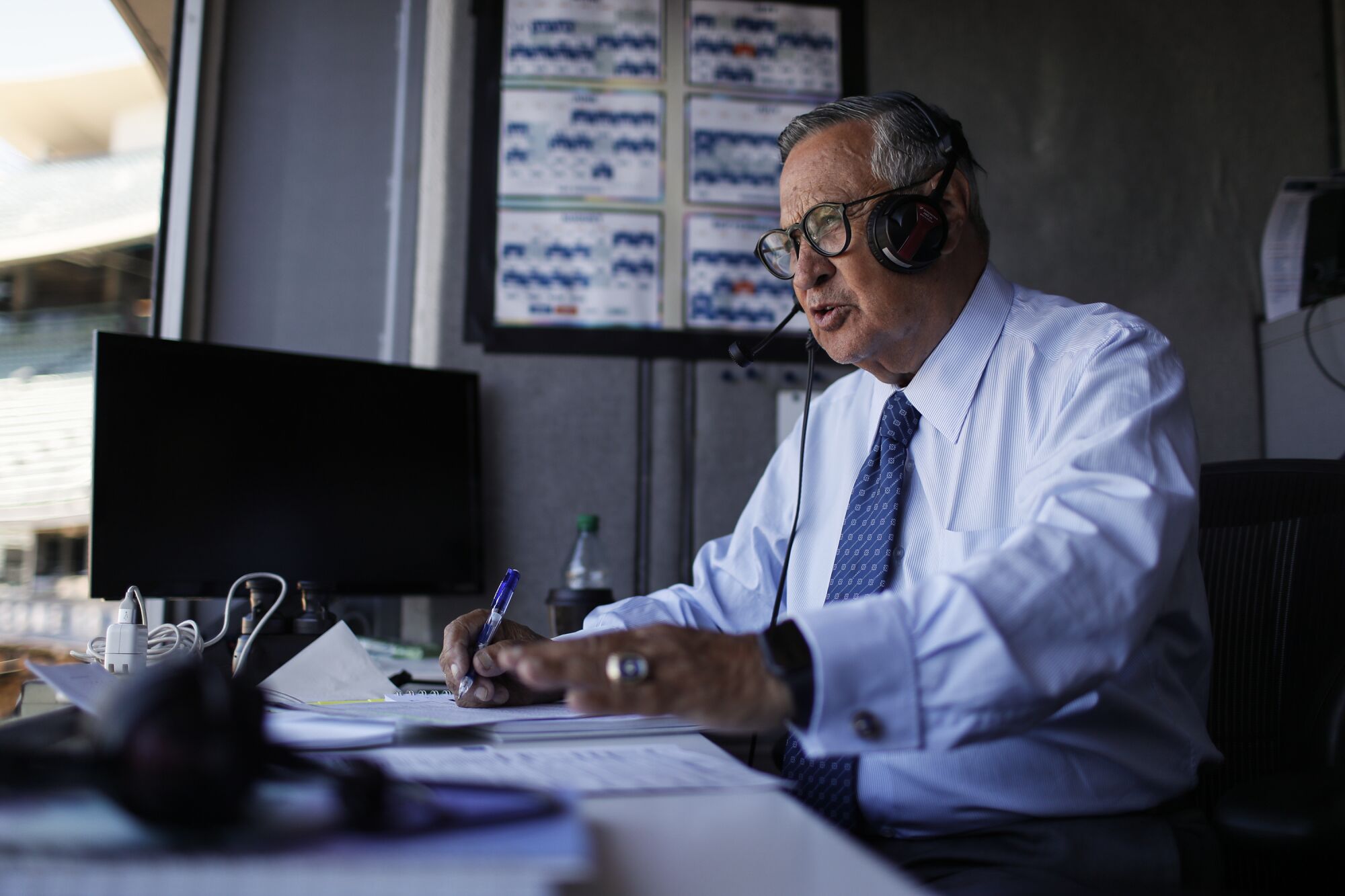 Dodgers broadcaster Jaime Jarrín prepares for a game at Dodger Stadium in July.