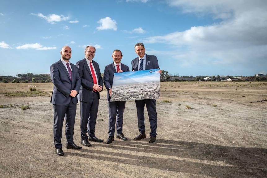 Four men in suits at a media event announcing plans for a new refinery in Kwinana.  