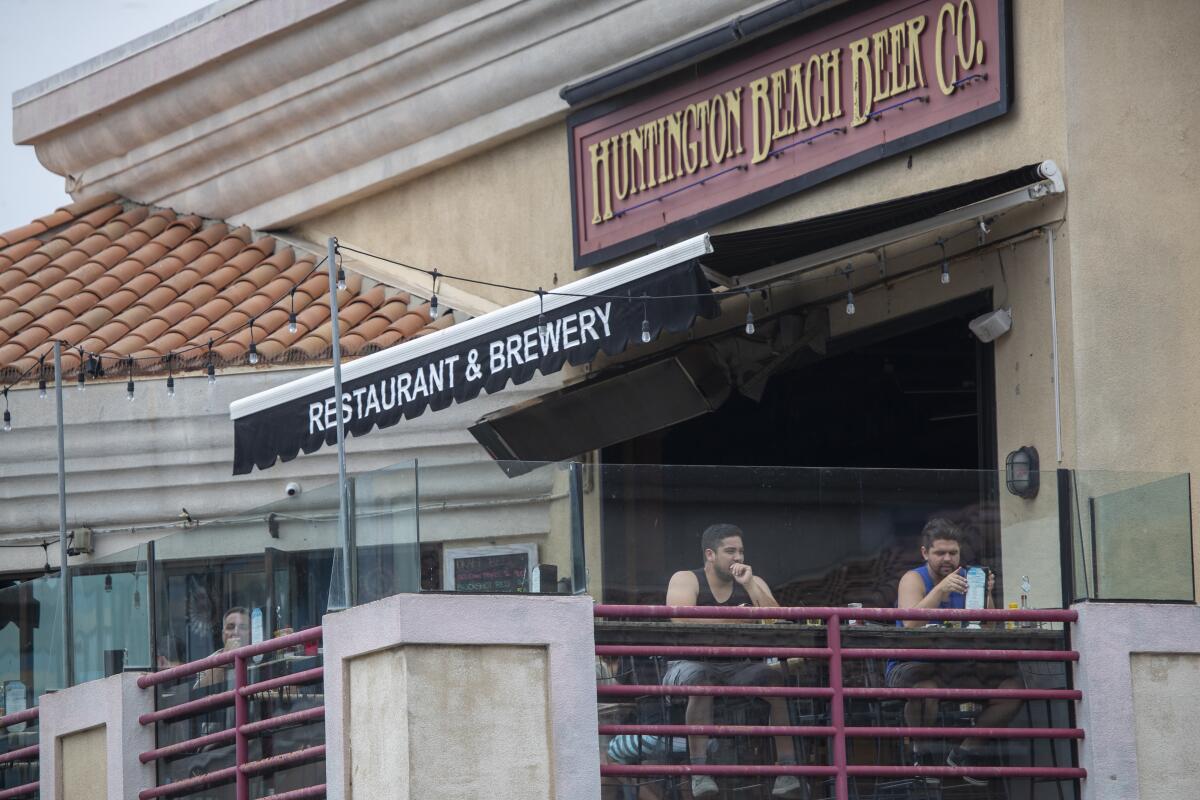 Patrons relax at Huntington Beach Beer Co. Restaurant & Brewery